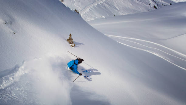 istock extreme skier in powder snow 869478646