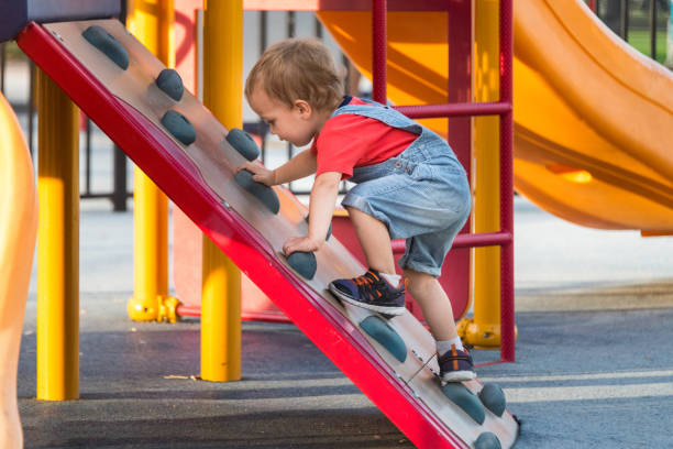 istock Male Toddler Playing at the playground 869488712