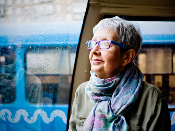 istock Senior woman in tram 869489228