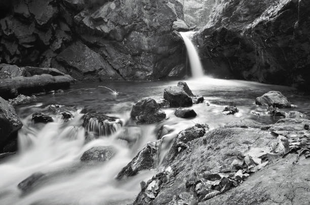 istock Big waterfall on Silver creek, Nyznerov, Czech Republic 869489444