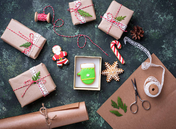 istock Process of packing boxes with Christmas gifts presents 869489870