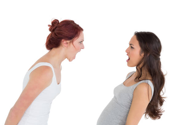 istock Angry young female friends having an argument 869496022