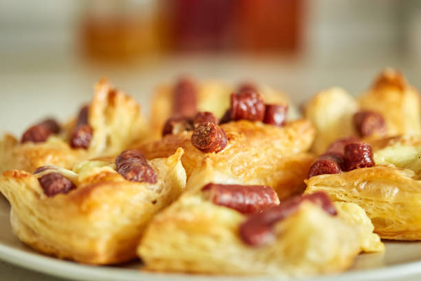 Pastry with small sausages and cheese, homemade