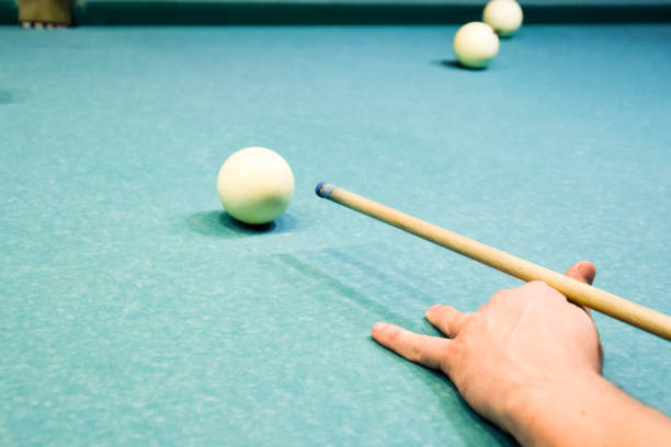 istock Billiards, billiard table. Targeting the cue in the ball for impact 869502694