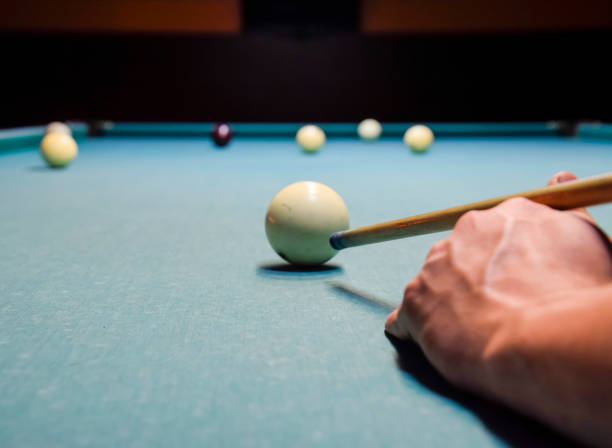 istock Billiards, billiard table. Targeting the cue in the ball for impact 869502698