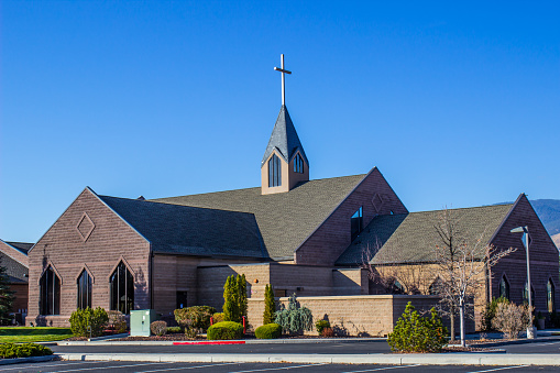 Part of an old church with deep blue sky behind.