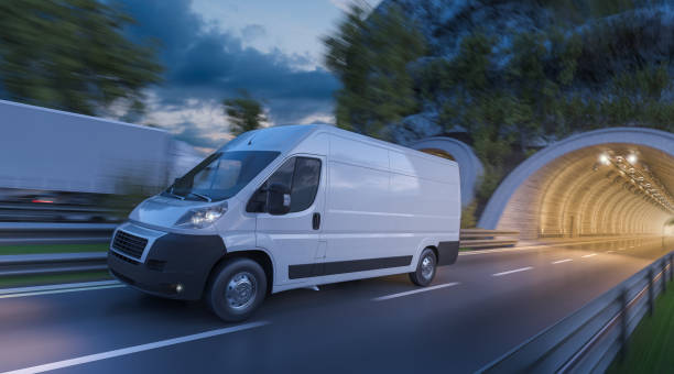 Delivery Van and a Truck on the Move at Sunset