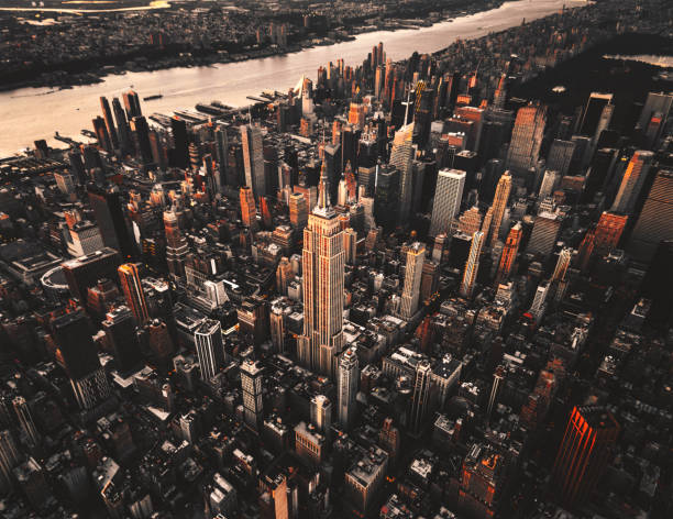 istock empire state building aerial view at dusk 869506404
