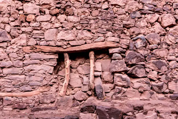 Megdaz, Morocco, 15 October, 2017:  A wall of a household in Megdaz, a traditional Berber village situated in high Atlas mountains, built on mountains slopes, made of a mixture of stones, earth and straw.