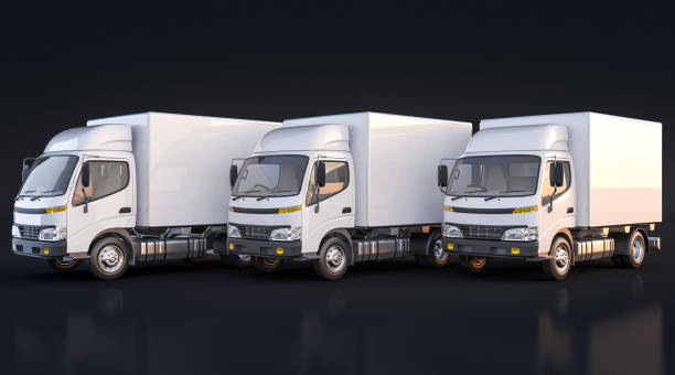 istock Isolated Delivery Trucks on Black Background 869507432