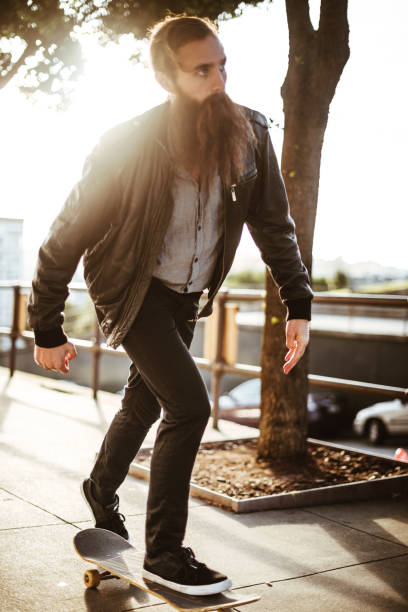 istock hipster with his skateboard on san francisco 869514040
