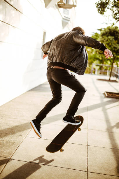 istock hipster with his skateboard on san francisco 869514140
