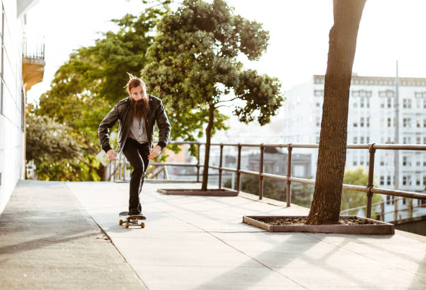istock hipster with his skateboard on san francisco 869514192