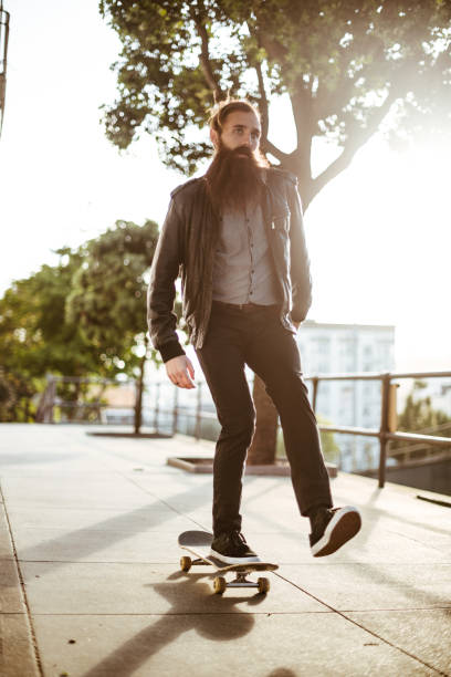 istock hipster with his skateboard on san francisco 869514334