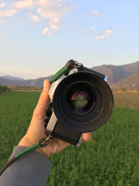 istock Holding my film camera pointing at myself 869519906