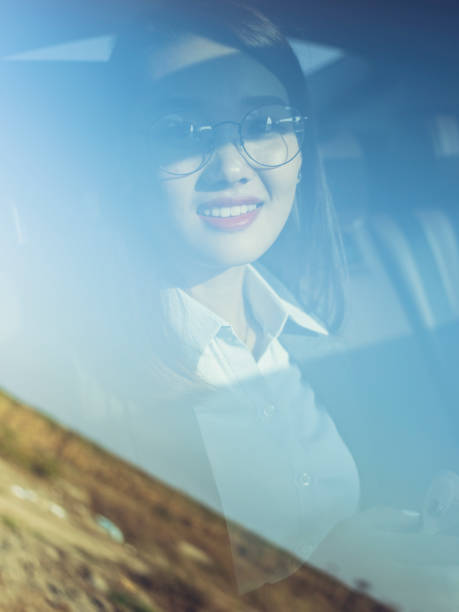 istock young businesswoman using cellphone on car backseat 869534454