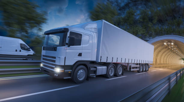 Image of a Semi Trailer Truck and a Delivery Van on the Road stock photo
