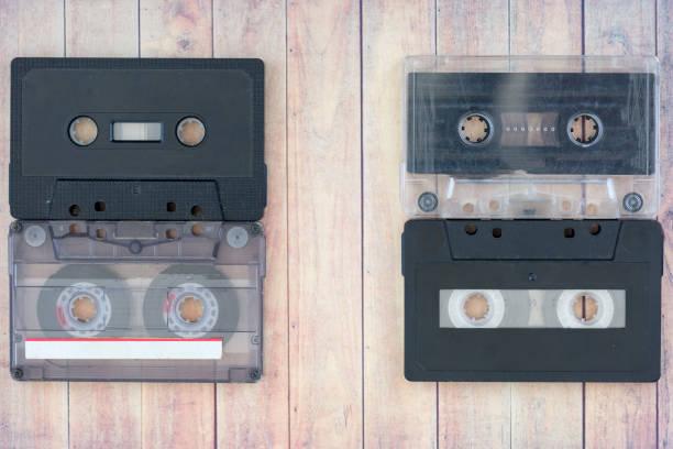 istock Old cassette tapes with a wooden background 869538460