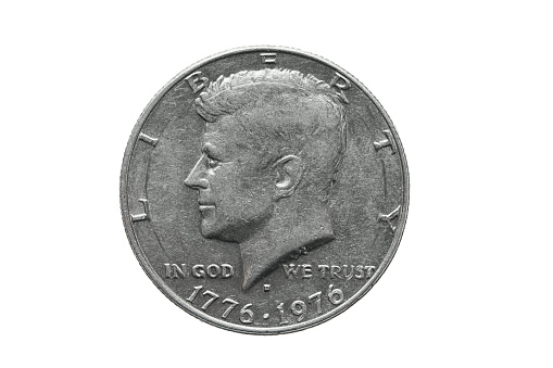 American old coin worth half dollar US with John Kennedy portrait. Extreme close up macro shot. isolated on white.