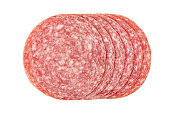 Sliced summer sausage salami isolated on white background, top view.