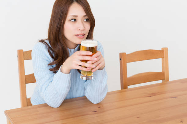 istock woman who drinks beer 869545030