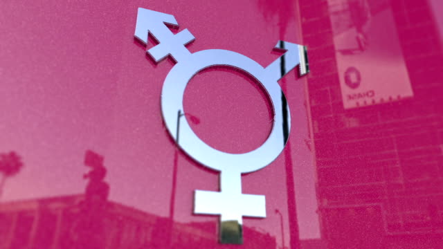 Transgender Symbol On A Pink Metallic Background