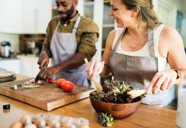 istock A couple is cooking in the kitchen together 869573930