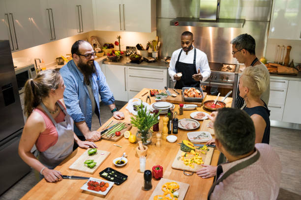 istock Group of friends are cooking in the kitchen 869574340