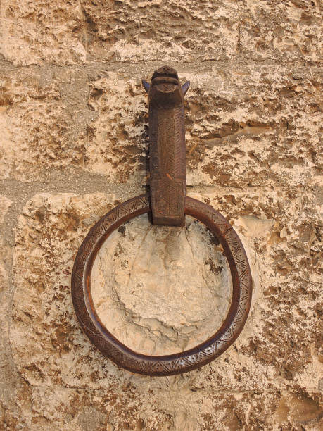 istock Ancient wall metal ring to tie horses 869577252