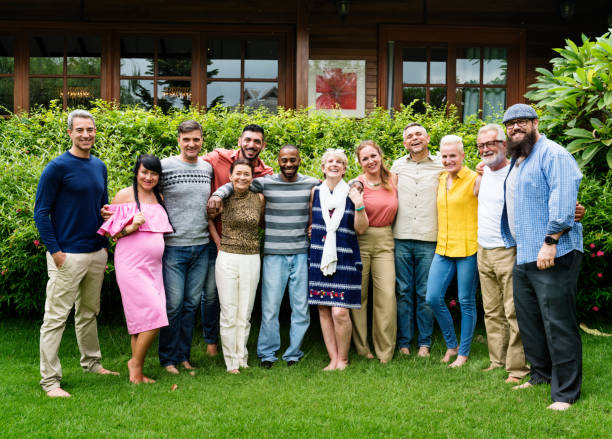 istock Group of diverse friends taking a photo together 869578332