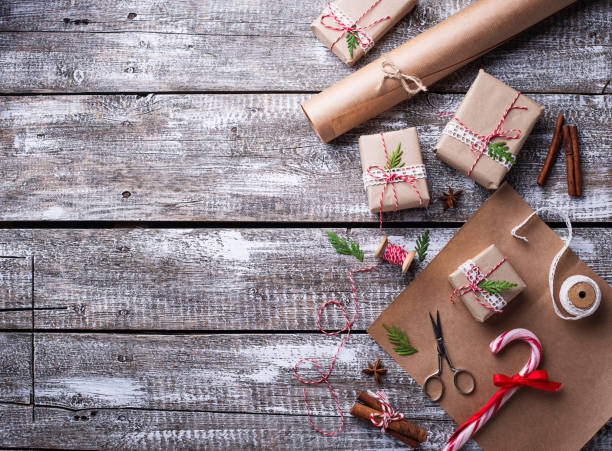istock Process of packing boxes with Christmas gifts presents 869584128