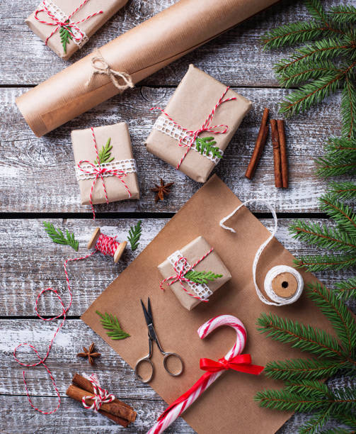 istock Process of packing boxes with Christmas gifts presents 869584242
