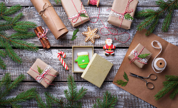istock Process of packing boxes with Christmas gifts presents 869584490