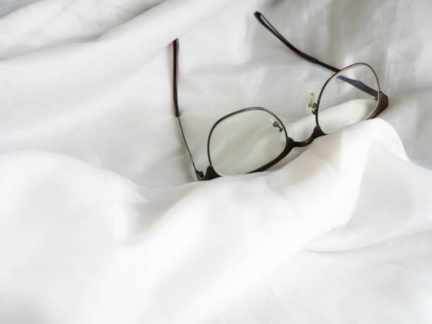 istock Eye glasses in the bed 869585272