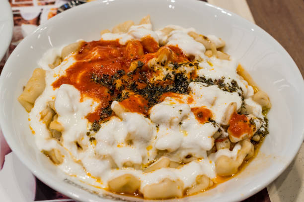 istock Turkish Manti Manlama with yogurt and fried butter sauce 869587600