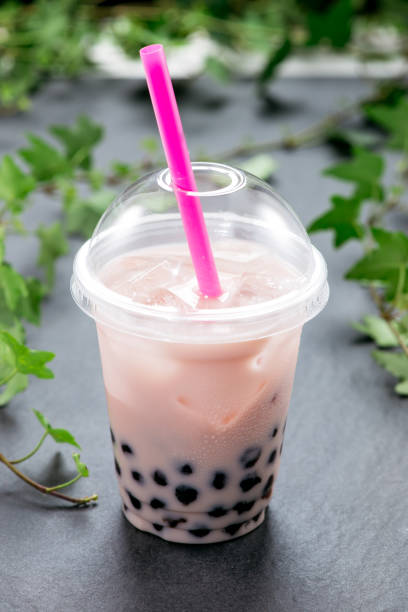 istock Bubble boba tea with milk and tapioca pearls in plastic cup 869594698