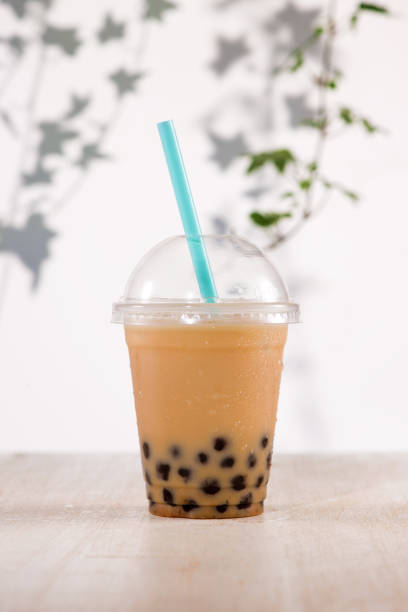 istock Homemade milk bubble tea in plastic cups on table. 869594910