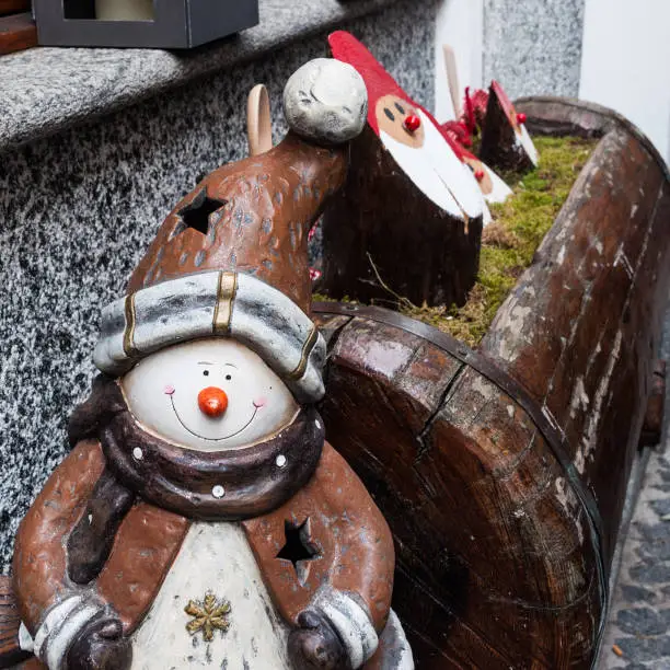 Street decoration in a street market, in the form of snowman and gnome, near the Lago Maggiore, North of Italy