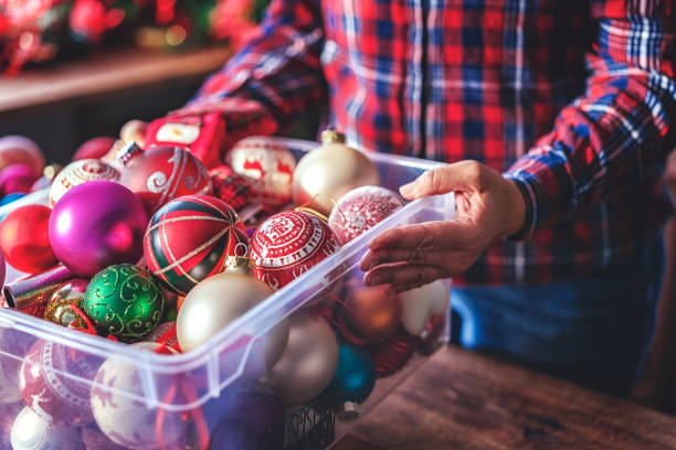 istock Decorating Christmas Tree with Ornaments and Christmas Lights 869598610