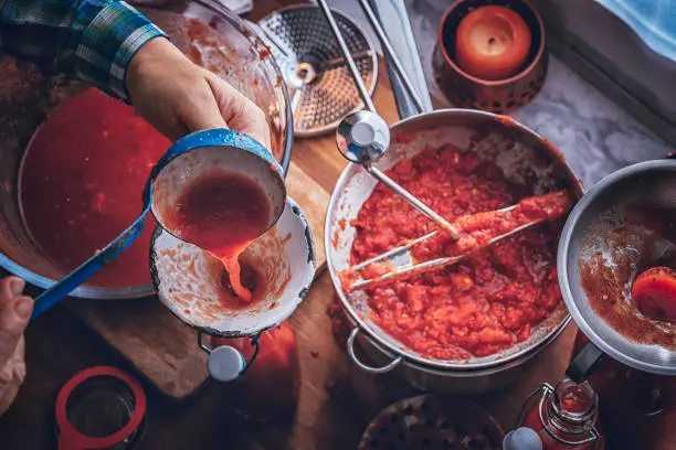 Preparing Homemade Tomato Sauce and Preserving in Bottles