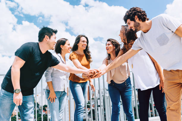 istock Group of friends celebrating teamwork 869599086