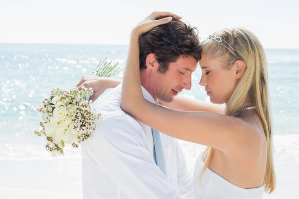 istock Romantic couple embracing on their wedding day 869599264