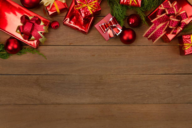 istock Christmas red gift box with wooden background 869602632
