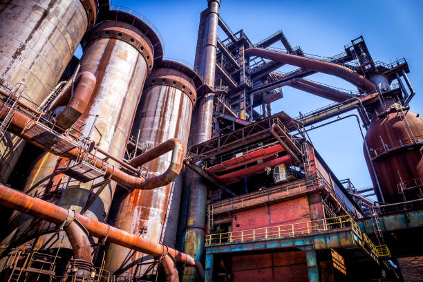 istock Old rusty steel equipment in inactive the steel mill 869602896