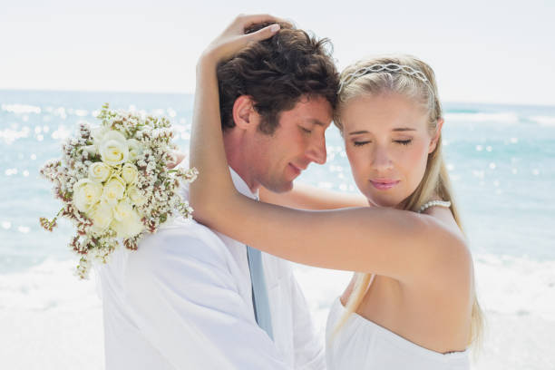 istock Romantic couple embracing on their wedding day 869603064