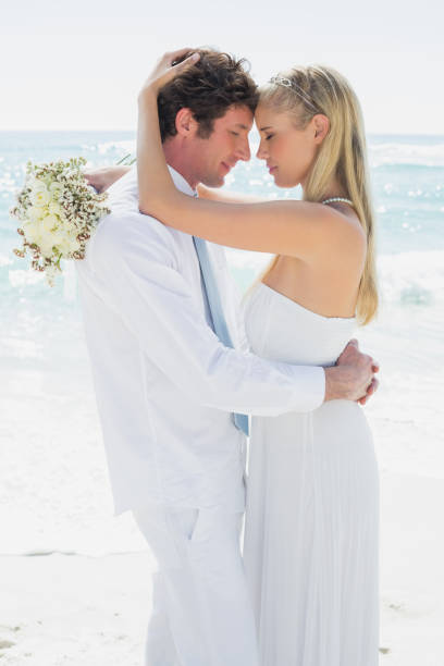 istock Romantic couple hugging each other on their wedding day 869603094