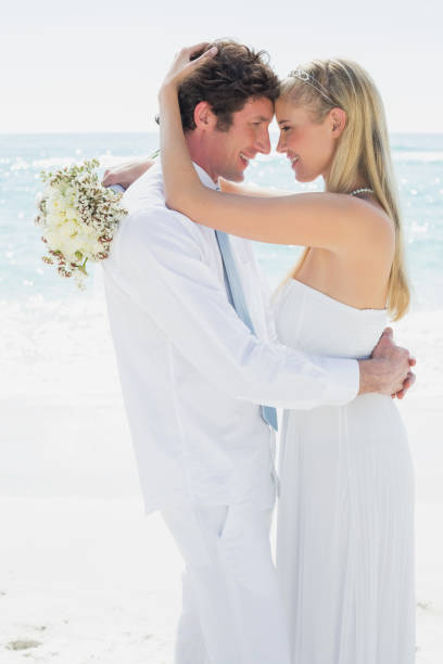 istock Couple embracing each other on their wedding day 869603126