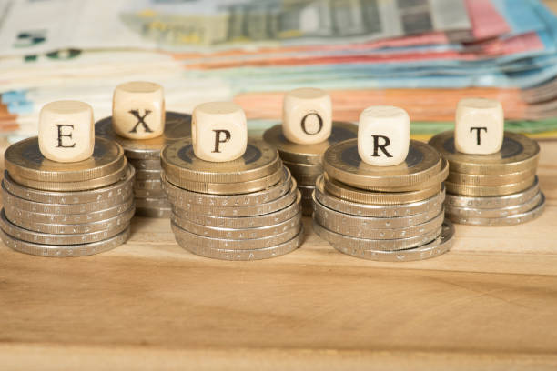 istock Euro banknotes and coins and export 869606954