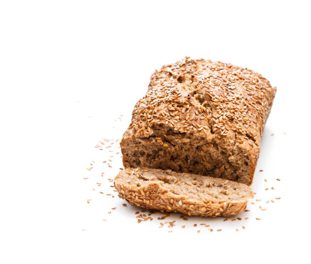 istock Homemade  wholemeal rye bread with flax seeds isolated on white 869612408