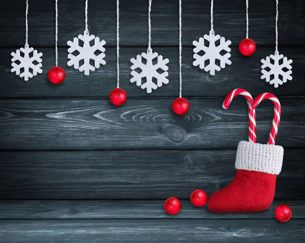 istock Christmas background with Santa boot, balls and snowflakes 869613868